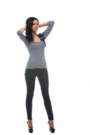 白い背景の上の笑顔若い女性モデル立ちの全長 の写真素材 画像素材 Image