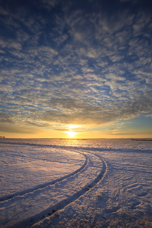 winter landscape colorful sunrise over the snow-covered field
