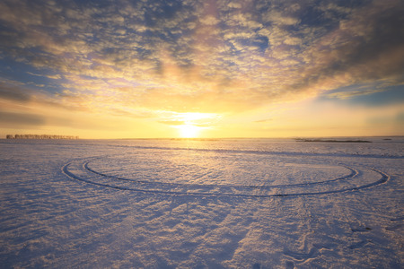 winter landscape colorful sunrise over the snow-covered field