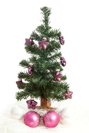 plastic christmas tree with purple stars and pink balls isolated on white background stock photo - White Fake Christmas Tree plastic christmas tree with purple stars and pink balls isolated on white background stock photo - White Fake Christmas Tree