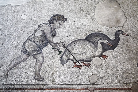 Ancient roman mosaic from the Great Palace of Constantinople depicting a boy herding geese. Stock Photo - 55057895