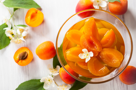 Peach flower: Fresh apricot compote in glass bowl