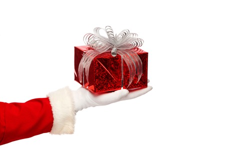 santa claus giving a small christmas present box in snowy night small christmas present