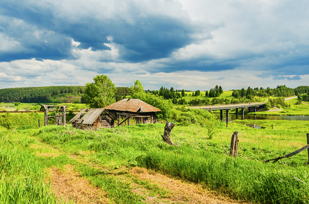 russian rural landscape abandoned destroyed old house on the