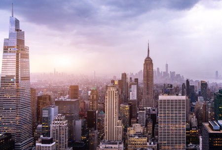 Skyscraper tower close up with beautiful sky and clouds at sunset Stock Photo