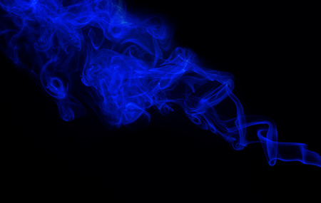 Swirl of blue smoke on black background Stock Photo