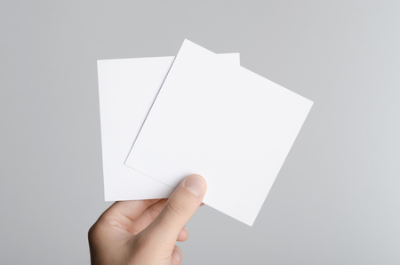 square flyer invitation mock up male hands holding blank stock blank flyers