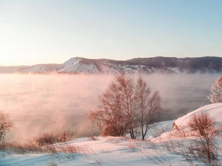 Steam over lake baikal in winter