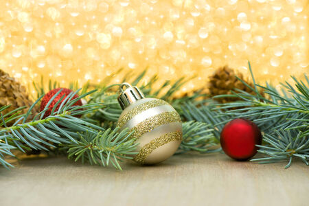 red and gold christmas ornaments with spruce boughs on a sparkle background with stars stock - Gold Christmas Ornaments red and gold christmas ornaments with spruce boughs on a sparkle background with stars stock - Gold Christmas Ornaments