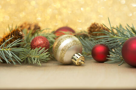 red and gold christmas ornaments with spruce boughs on a sparkle background stock photo - Red And Gold Christmas Ornaments red and gold christmas ornaments with spruce boughs on a sparkle background stock photo - Red And Gold Christmas Ornaments
