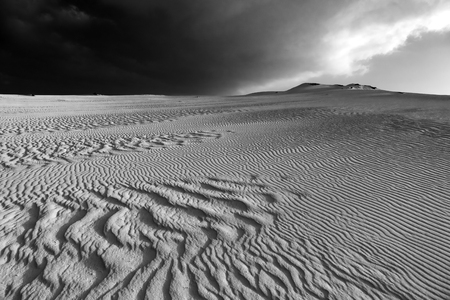 Low sun late afternoon, with sand patterns and textures in the natural park, corralejo, fuerteventura, canary islands, spain