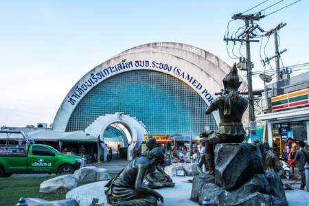 Rayong, thailand - march 31, 2019: view of entrance pier gate to samed island with phra aphai mani and the mermaid statue on koh samet island in rayong, thailand.