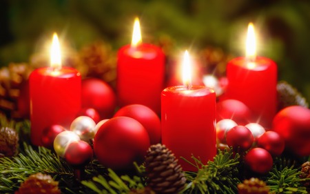 Studio shot of a nice advent wreath with baubles and four burning red candles - 46937748