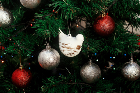 silver and red christmas ornaments hanging from green christmas tree with blue lights focus on - Green And Silver Christmas Decorations silver and red christmas ornaments hanging from green christmas tree with blue lights focus on - Green And Silver Christmas Decorations