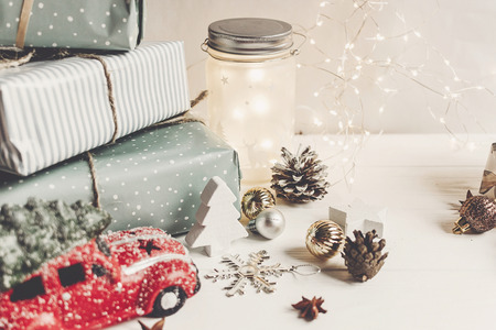 modern christmas ornaments and car toy with tree presents cones anise on white wooden background - Modern Christmas Ornaments modern christmas ornaments and car toy with tree presents cones anise on white wooden background - Modern Christmas Ornaments