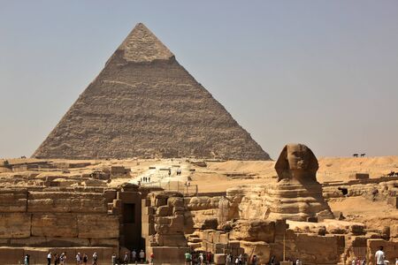 The great sphinx of giza with the pyramid of khafra in the background