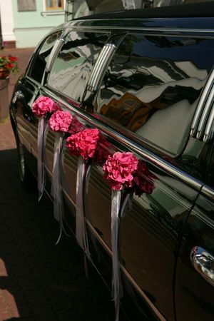 Luxurious black stretch limousine decorated with flowers - 4767560