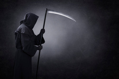Grim reaper with scythe in the dark Reklamní fotografie