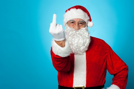 Agitated Santa showing his middle finger to the camera Stock Photo - 16510656