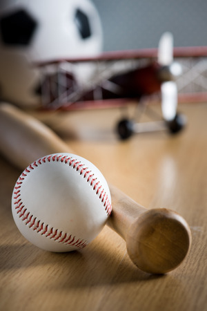 Baseball Bat And Hardball On Wooden Floor With Toy Plane And Stock Extraordinary Wooden Baseball Game Toy Baseball Bat And Hardball On Wooden Floor With Toy Plane And Stock Extraordinary Wooden Baseball Game Toy