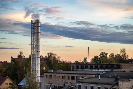 Pipe factory smoke in the background of a beautiful sky