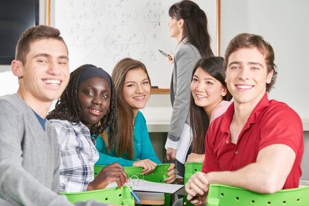 Interracial group of teenage students in math class