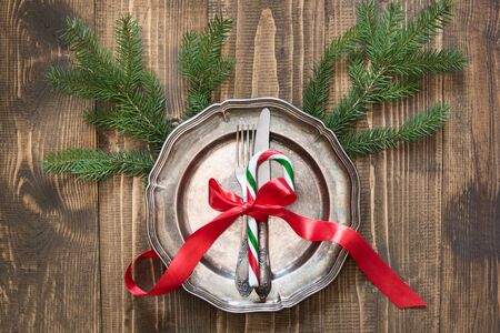 christmas table setting with candy cane and red ribbon as decor vintage dishware silverware - Candy Cane Christmas Table Decorations christmas table setting with candy cane and red ribbon as decor vintage dishware silverware - Candy Cane Christmas Table Decorations