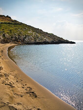 Beautiful sandy beach and overcast sky. marmari in laconia, greece. Stock Photo