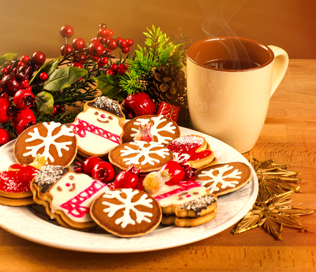 mug with hot drink and christmas cookies background with a cup christmas cookies background