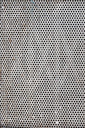 metal plate with many small circular holes macro texture background metal sheet with small holes