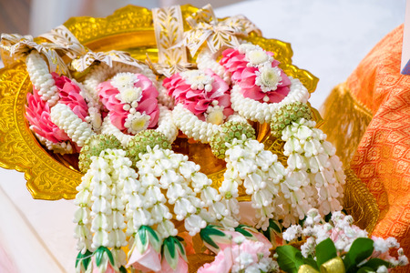 thai flower garlands on a tray with pedestal in a wedding ceremony day