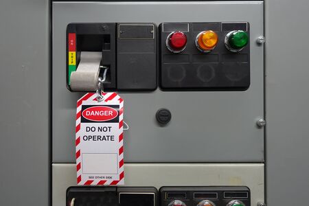 Red, white lock out & tag out for lock station,machine - specific or switch gear roomd evices and safety first point, cyber security or safety industrial concept.