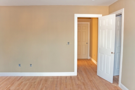 newly constructed house interior room with unfinished wood floors