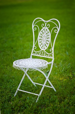 Metal White Garden Chair On Grass In Wedding Ceremony Stock Photo Metal White Garden Chair On Grass In Wedding Ceremony Stock Photo