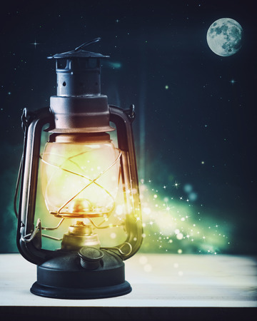 Moonlight lanterns: Wonderful night and vintage magic lantern on the window, abstract holidays background