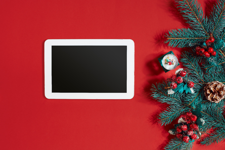 christmas decorations and white tablet with black screen on hot red background christmas and new - Red White And Turquoise Christmas Decor christmas decorations and white tablet with black screen on hot red background christmas and new - Red White And Turquoise Christmas Decor