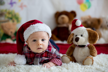 Christmas Portrait Of Cute Little Newborn Baby Boy Dressed In