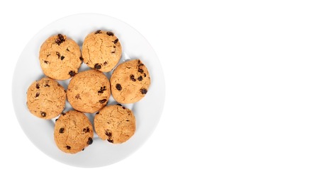 pile of chocolate chip cookies on a dish isolated on white