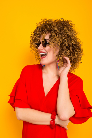 Close Up Portrait Of A White Woman With Afrro Curly Hairstyle