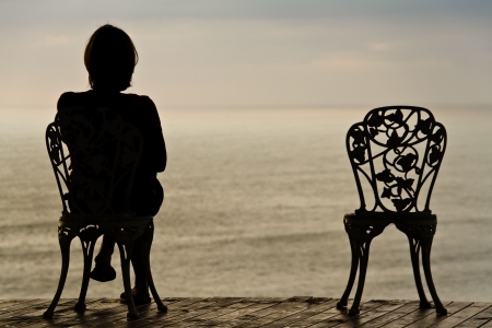 sad lonely: Lonely girl sitting on a vintage chair