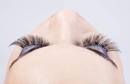 ресницы: detail of the make up of eyelashes in a young beautiful girl