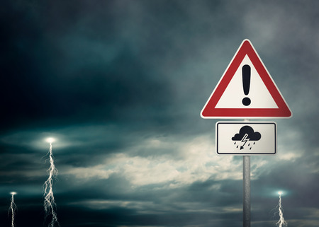 Caution - thunder storms ahead - a dark cloudy sky with lightning bolts and a warning sign in the foreground - computer generated image