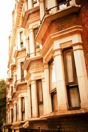 Row of georgian style houses in london with bay windows in warm tones Reklamní fotografie