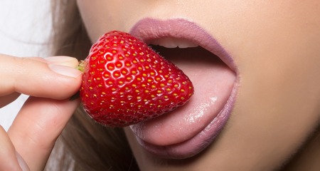 Sexy Female Mouth With Pink Lipstick On Lips Eating And Licking With Tongue Red Sweet Strawberry Sexy Female Mouth With Pink Lipstick On Lips Eating And Licking With Tongue Red Sweet Strawberry