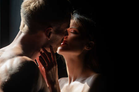 Closeup face of a beautiful young couple in love embracing, romance and and affection. sensual couple in the tender passion. Closeup face of a beautiful young couple in love embracing, romance and and affection. sensual couple in the tender passion.