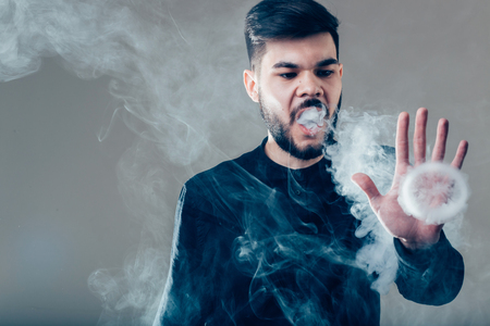 Men with beard vape and produse steam rings