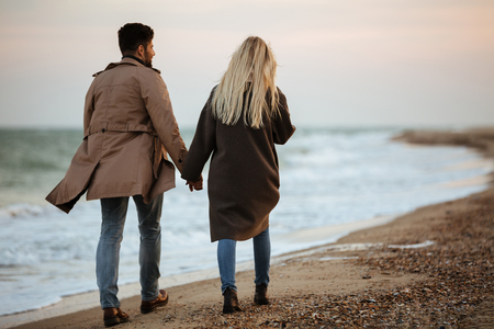 Back View Of A Young Couple In Love Holding Hands While Walking - 450x300 - jpeg People Holding Hands Walking