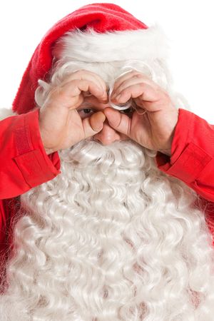 Funny santa claus looking through hand's binocular