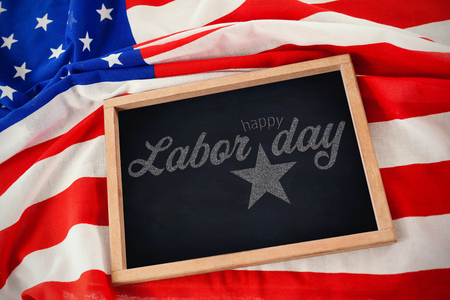 Digital composite image of happy labor day text with star shape against american flag with chalkboard