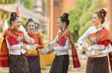 Thai girls and laos girls splashing water during songkran festival water blessing ceremony of adults buddha statue water ceremony in songkran festival thailand traditional Stock Photo